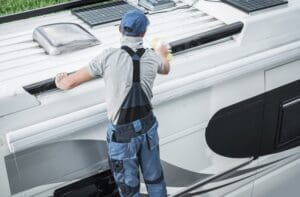 How To Winterize your RV(https://eldoradorv.com/how-to-winterize-your-rv-2/) – Rv service worker cleaning camper van roof 8QZ86NF 2